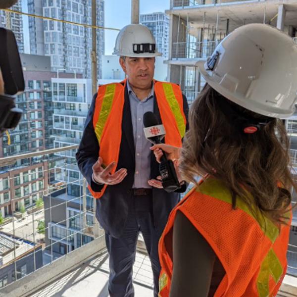 TCHC CEO Jag Sharma speaks to a reporter about the progress of Phase 3 construction at building 16N, and the role TCHC has as a City builder in the City of Toronto.