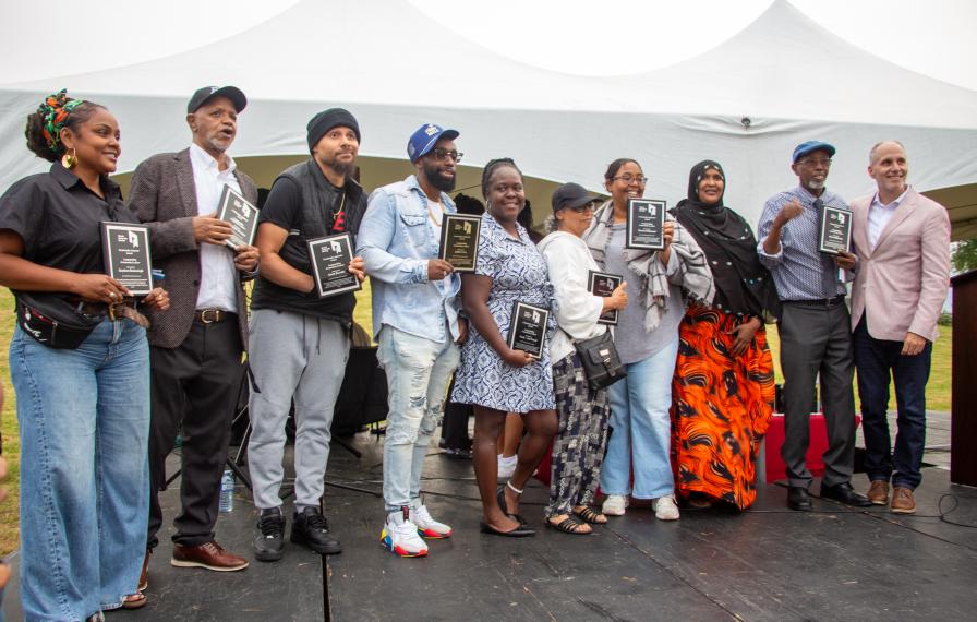 A group of TCHC People’s Choice Award recipients pose on stage for a photo at TCHC’s Lawrence Heights Summer Festival.