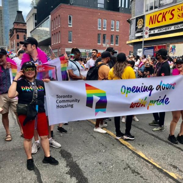 TCHC staff holding a banner at the Toronto Pride parade