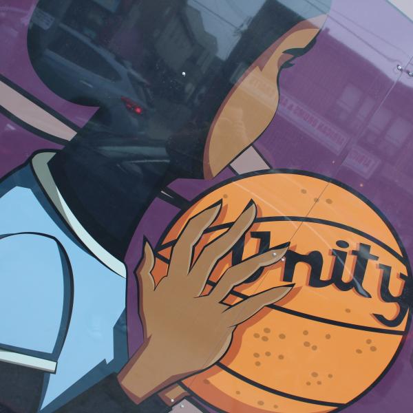 Mural illustration of youth holding a basketball