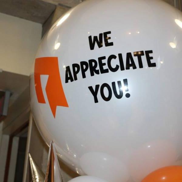 A white balloon with the Toronto Community Housing logo and the text "we appreciate you"