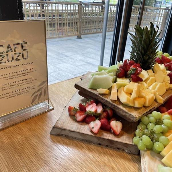 A tray of fruit on a table. 