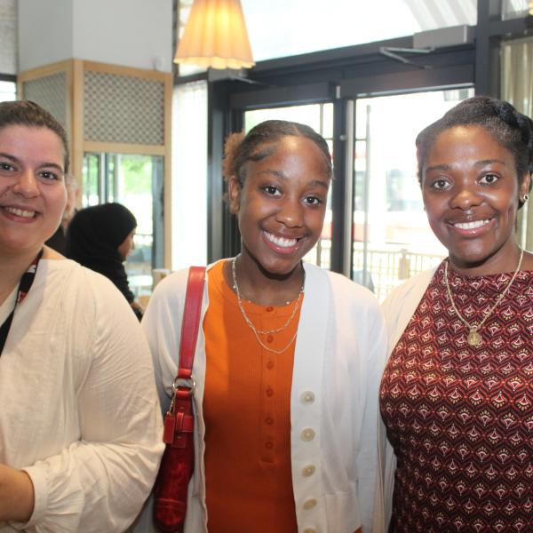 A group of women smiling. 