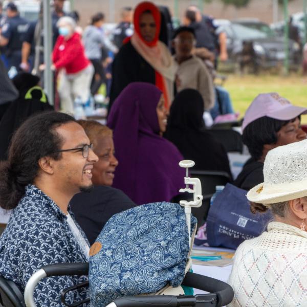 Community residents listening in to the formal remarks by TCHC organizers and guests at TCHC’s Lawrence Heights Summer Festival.