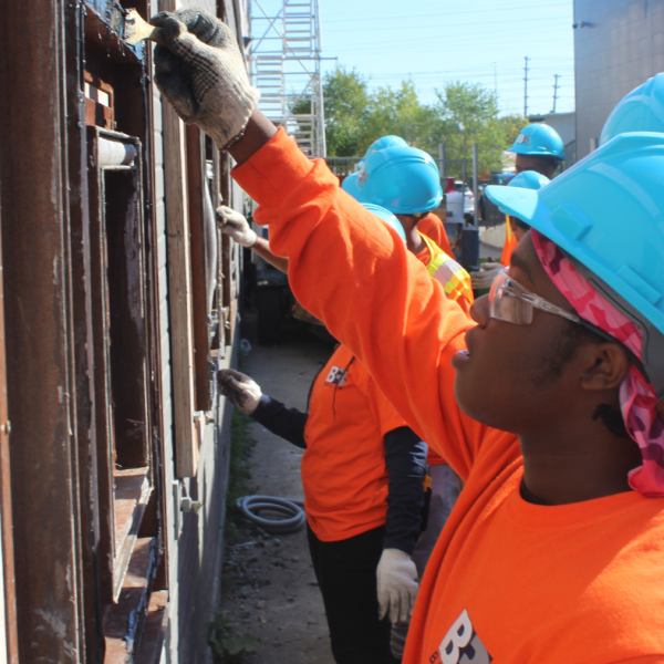 TCHC youth painting doors as part of the program