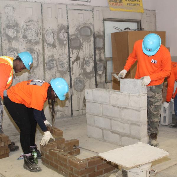 TCHC Youth building walls as part of the program
