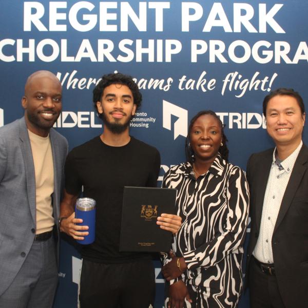 A scholarship recipient (second person on the left) standing with representatives from TCHC and Tridel. 