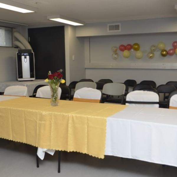 A photo of a room with tables and chairs
