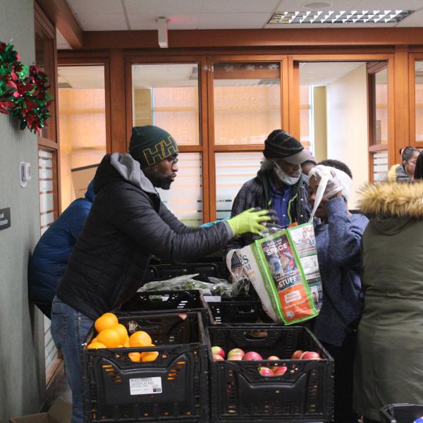 Garth helps visitors pick up fresh produce at SOSO ministries
