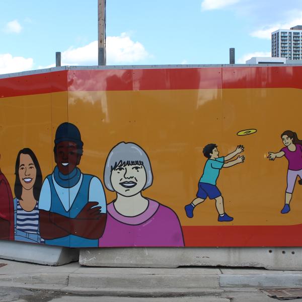 A corner segment of construction hoarding showing illustrations of kids, seniors, workers, and more people on an orange background.