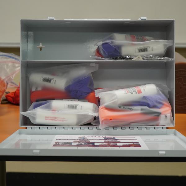 An open box with first aid materials inside