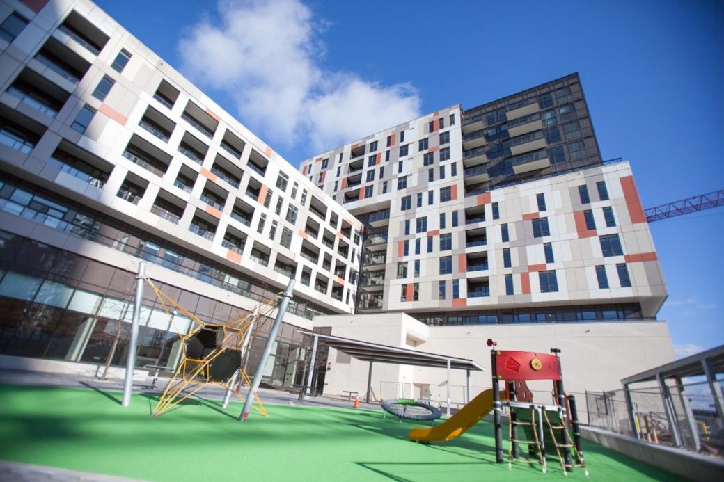 Outdoor photo of a building and playground