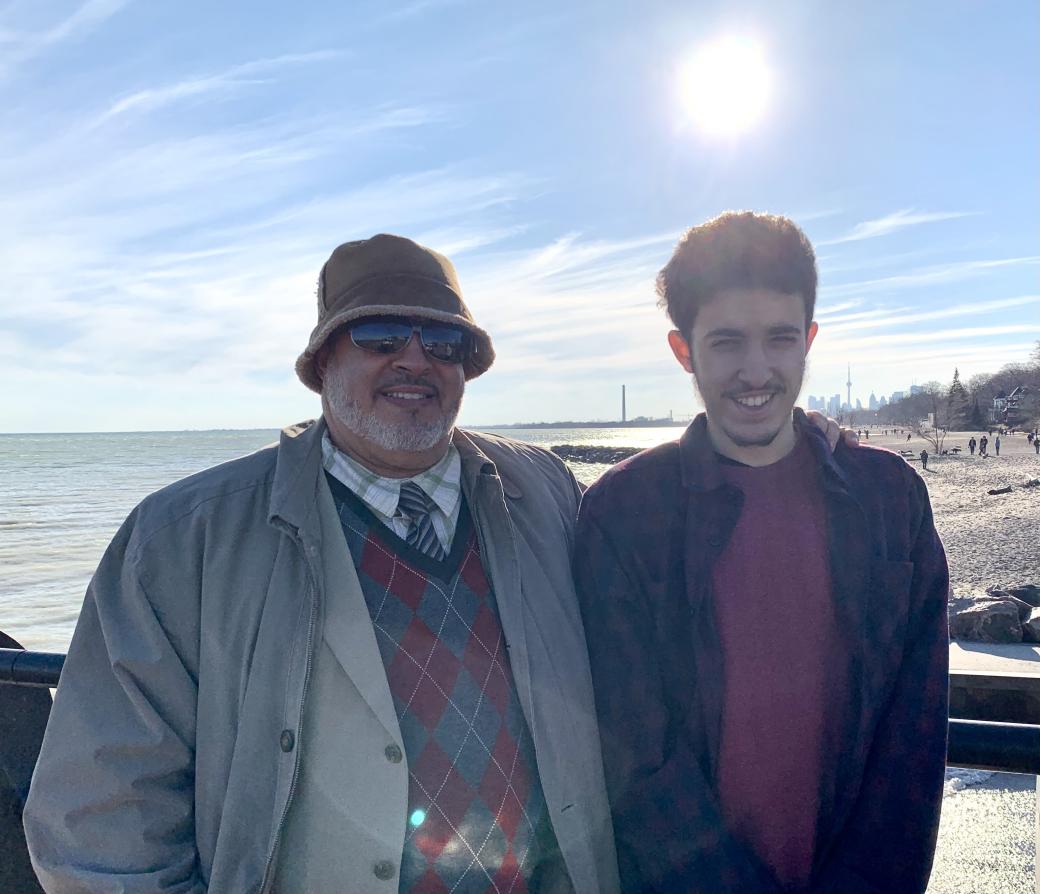 Scholarship winner Ibrahim Rfifi and his father Photo of scholarship winner Ibrahim Rfifi and his father standing outside by Lake Ontario