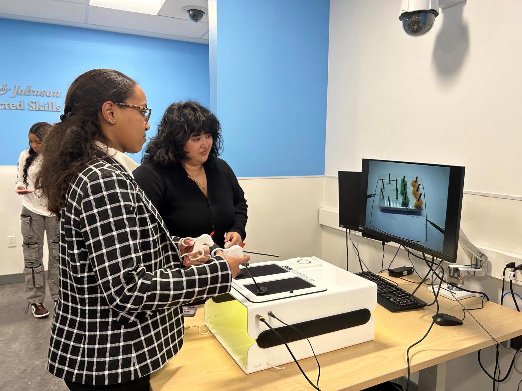 A person is shown holding a controller and watching a computer screen