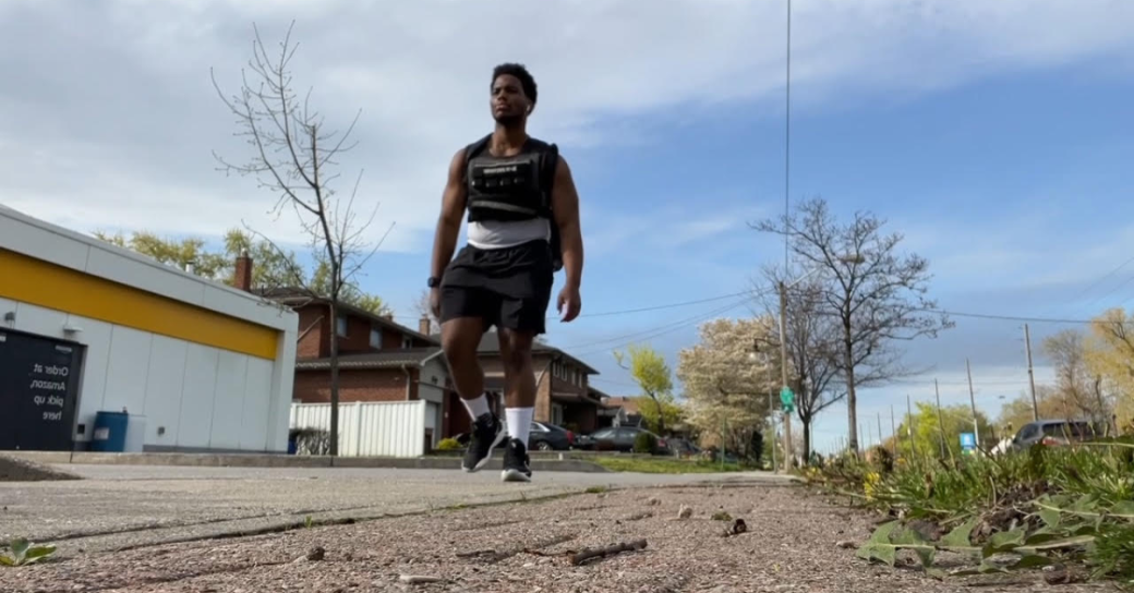 Trevaun Douglas completes his walk Trevaun Douglas, a young black man, walks down a road in Toronto, wearing a weighted vest.