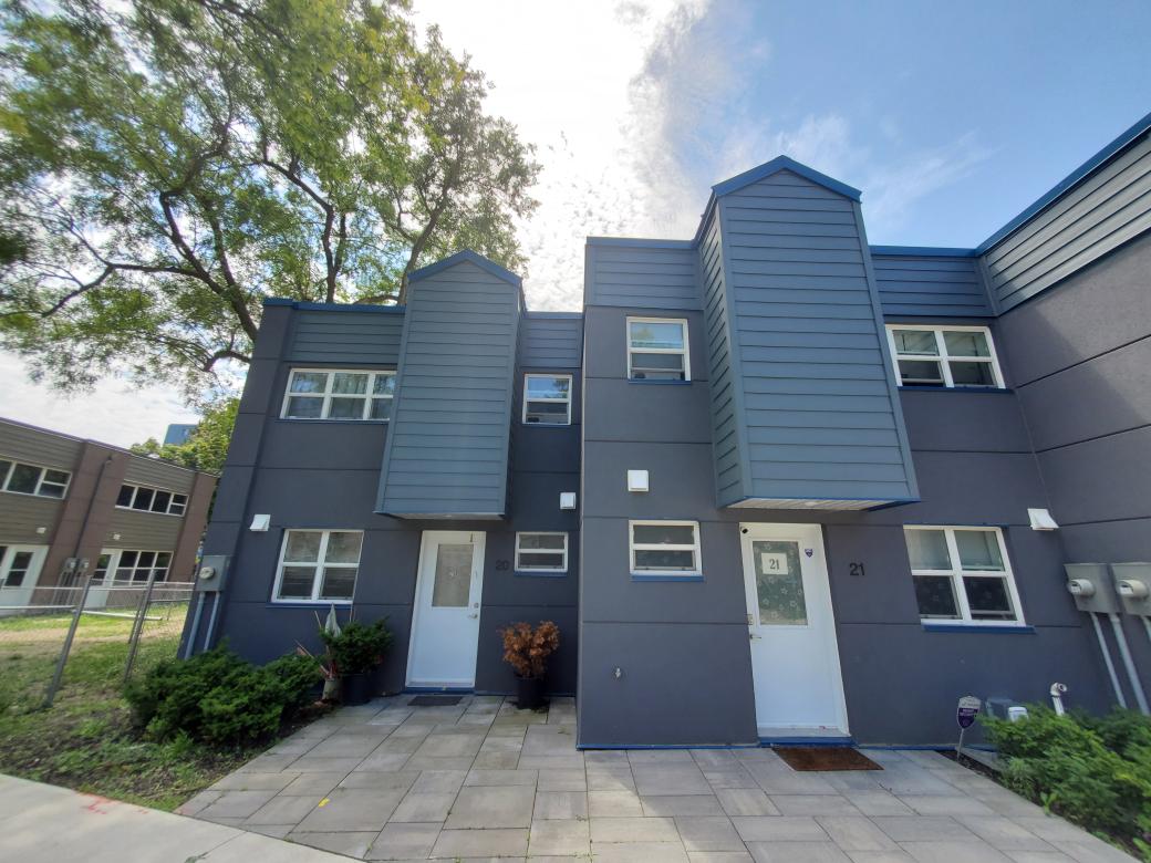 A building comprising of two, newly rehabilitated, TCHC family units at 410 McCowan. 