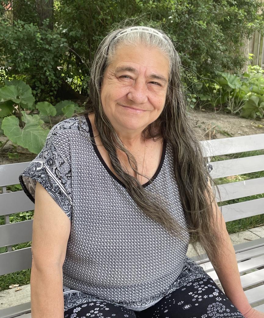 Ilona Bata, TCHC Tenant Representative at 220 Oak Street A person sitting on a bench