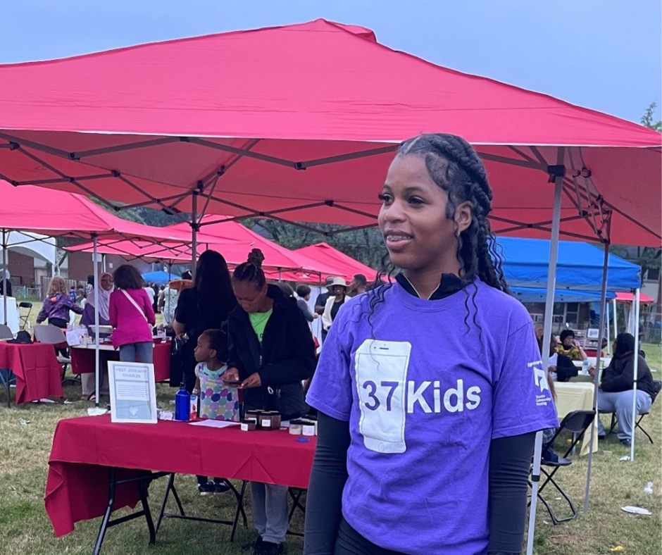 LaToya poses at the summer event in her 37 Kids uniform.