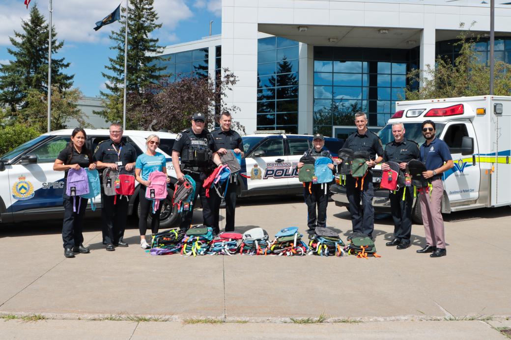 CSU officers with backpacks to give away