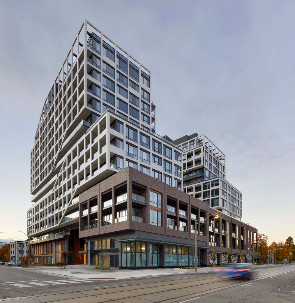 White and brown apartment building at 130 Augusta Ave