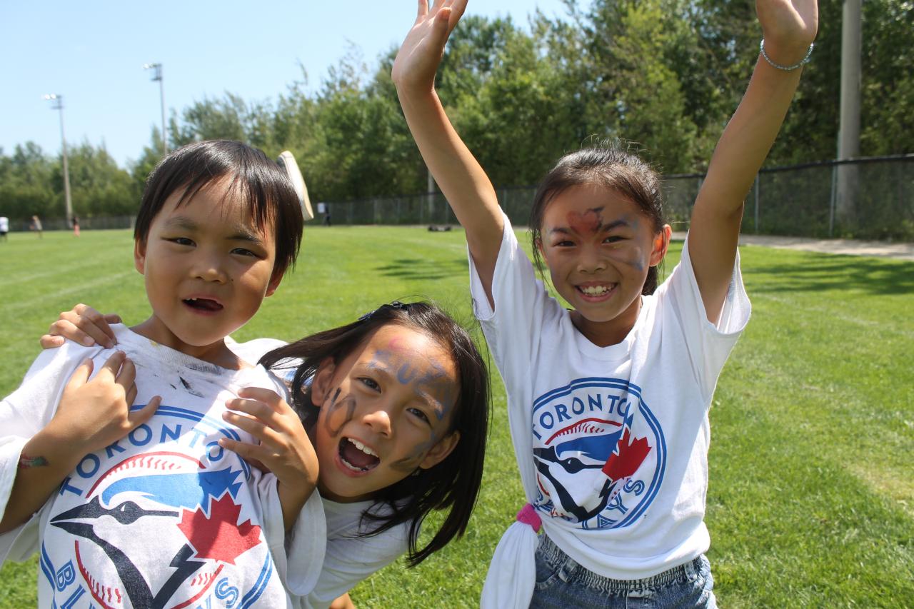 Three children in Blue Jays tshirts