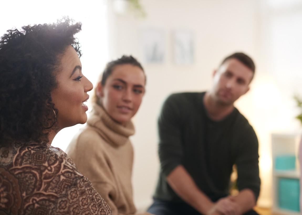 people looking at a speaker in a meeting