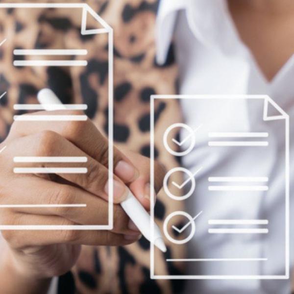 A close up of a person interacting with floating checklist icons. 